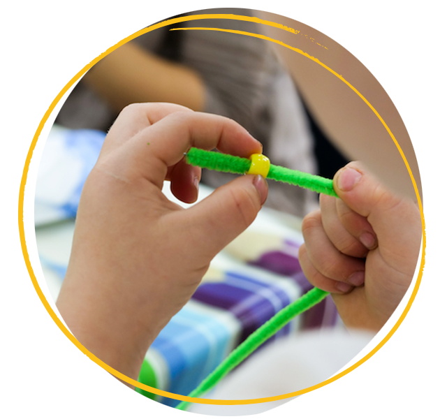 Child threading beads