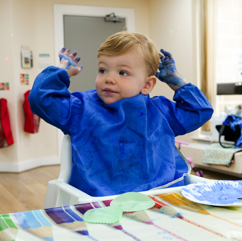 Boy with arms up